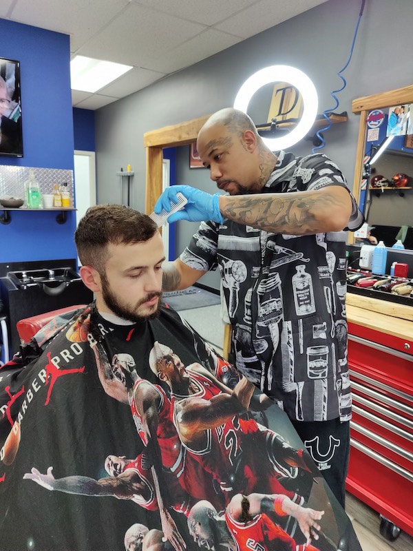 Chuck, barber at Paulie's Barber Shop