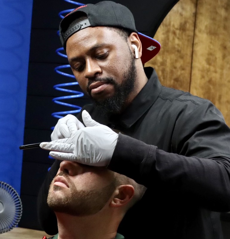 Cud, barber at Paulie's Barber Shop